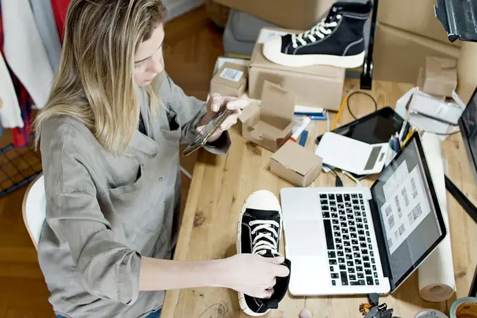 Small business owner setting up TikTok Shop content on phone