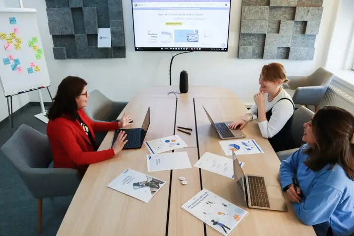Marketing team reviewing a competitor research template