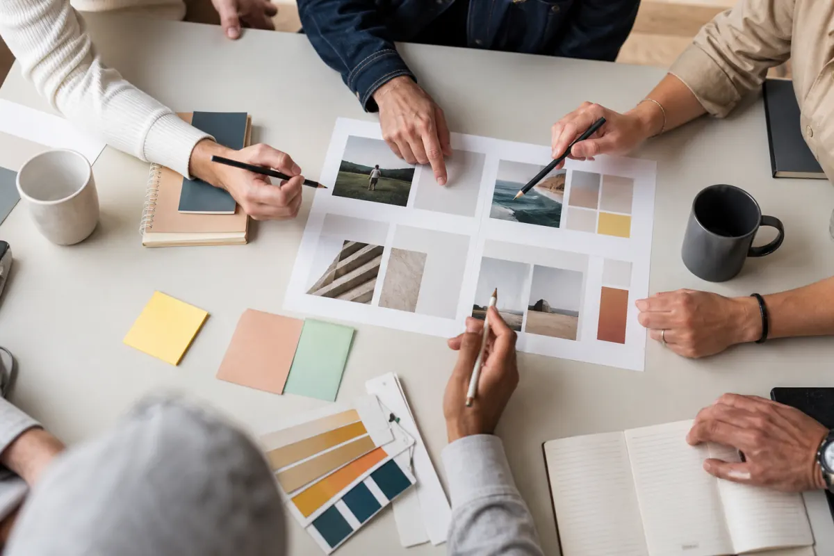 Marketing team reviewing a printed creative brief at a workspace